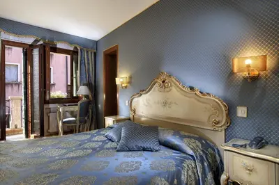 Letto o letti in una camera di Royal San Marco Hotel