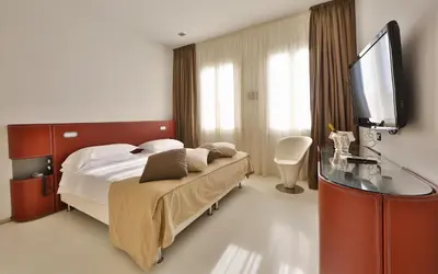 Letto o letti in una camera di Hotel Biasutti