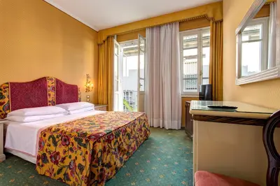 Letto o letti in una camera di Hotel Biasutti
