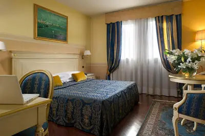 Letto o letti in una camera di Villa Pace Park Hotel Bolognese