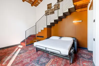 Letto o letti in una camera di Eurostars Residenza Cannaregio