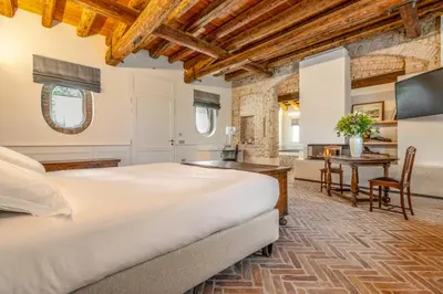 Letto o letti in una camera di Relais Barchessa Molon