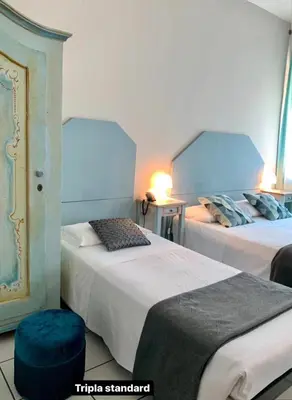 Letto o letti in una camera di Hotel Ariston