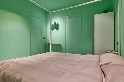 Letto o letti in una camera di AFTER8-FLAMINGO