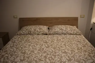 Letto o letti in una camera di Appartamento Balcone fiorito
