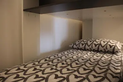 Letto o letti in una camera di Appartamento Balcone fiorito