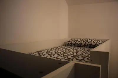 Letto o letti in una camera di Appartamento Balcone fiorito
