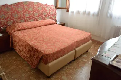 Letto o letti in una camera di Pensione Seguso