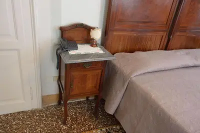 Letto o letti in una camera di Pensione Seguso