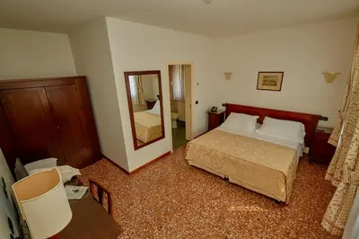 Letto o letti in una camera di Hotel Riviera dei Dogi