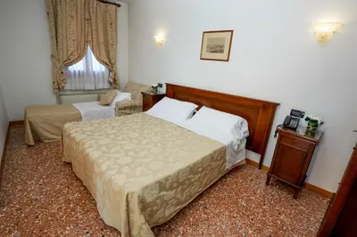 Letto o letti in una camera di Hotel Riviera dei Dogi