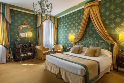 Letto o letti in una camera di Hotel Ca' dei Conti