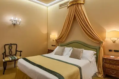 Letto o letti in una camera di Hotel Ca' dei Conti
