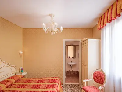 Letto o letti in una camera di Hotel Il Mercante di Venezia