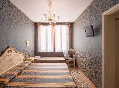 Letto o letti in una camera di Hotel Il Mercante di Venezia