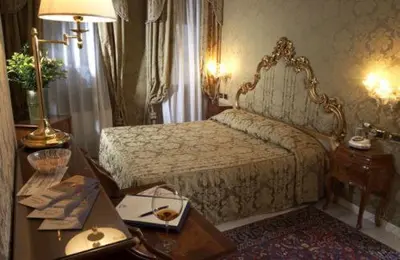 Letto o letti in una camera di Al Ponte Antico