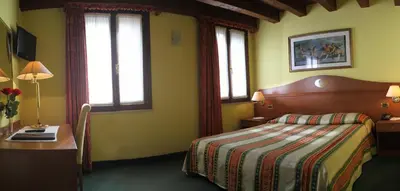 Letto o letti in una camera di Hotel Antico Moro