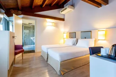 Letto o letti in una camera di BEST WESTERN Titian Inn Hotel Treviso