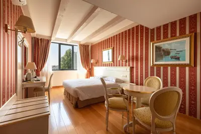 Letto o letti in una camera di Noventa Hotel