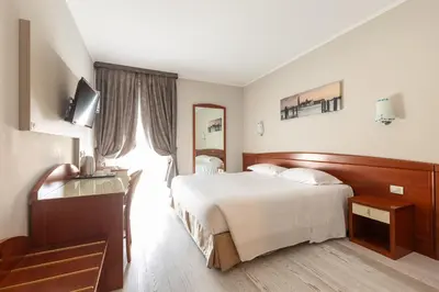 Letto o letti in una camera di Noventa Hotel