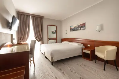 Letto o letti in una camera di Noventa Hotel