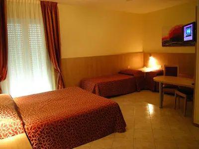 Letto o letti in una camera di Hotel San Carlo
