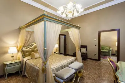 Letto o letti in una camera di Hotel Al Ponte Mocenigo