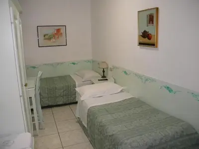 Letto o letti in una camera di Hotel Adua