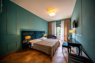 Letto o letti in una camera di Hotel Terme Milano