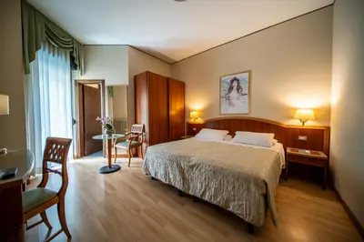 Letto o letti in una camera di Hotel Terme Milano