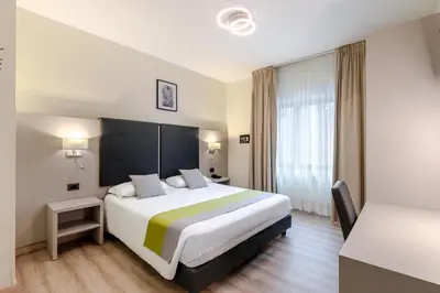 Letto o letti in una camera di Hotel Aurora