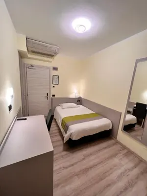 Letto o letti in una camera di Hotel Aurora