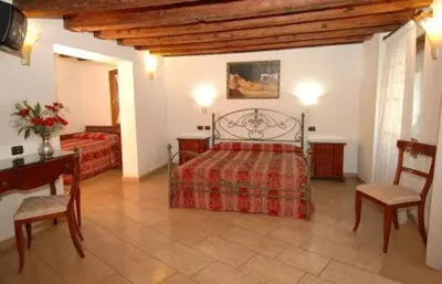 Letto o letti in una camera di Ca' Dei Leoni
