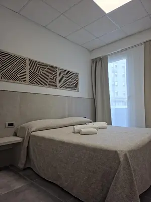 Letto o letti in una camera di Hotel Villa Reale