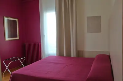 Letto o letti in una camera di Hotel Villa Reale