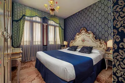 Letto o letti in una camera di Hotel Tre Archi