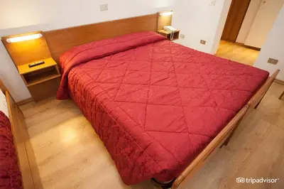 Letto o letti in una camera di Hotel Caprera