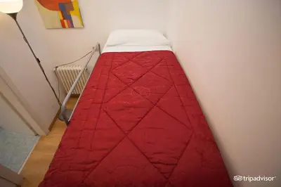 Letto o letti in una camera di Hotel Caprera