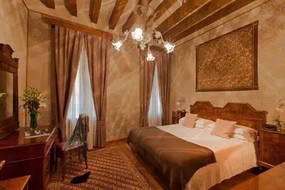 Letto o letti in una camera di Hotel Saturnia & International