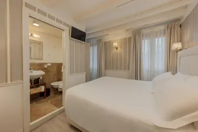 Letto o letti in una camera di Hotel Bartolomeo