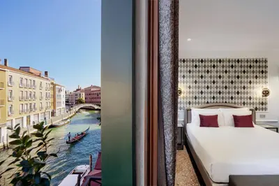 Letto o letti in una camera di Hotel Arlecchino