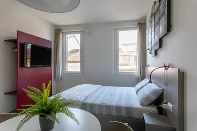 Letto o letti in una camera di Residenza SubitoSanto - Appartamento 5B 