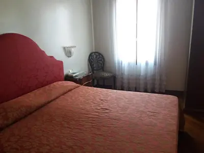 Letto o letti in una camera di Hotel Piccola Fenice