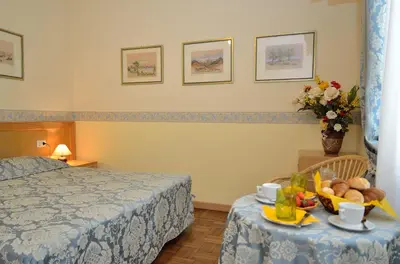 Letto o letti in una camera di Villa Angelica