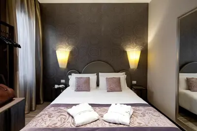 Letto o letti in una camera di Alle Guglie Boutique Hotel