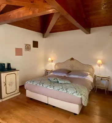 Letto o letti in una camera di Alloggi Ai Tessitori