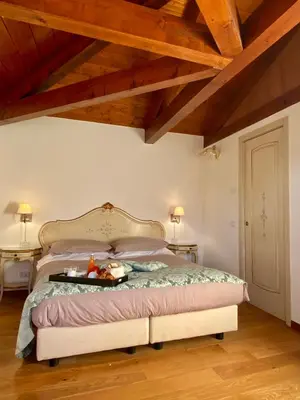 Letto o letti in una camera di Alloggi Ai Tessitori
