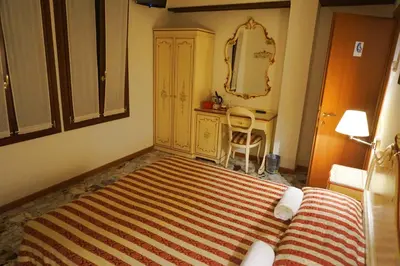Letto o letti in una camera di RIALTO EXPERIENCE