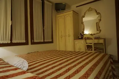 Letto o letti in una camera di RIALTO EXPERIENCE