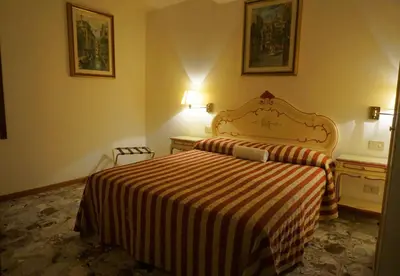 Letto o letti in una camera di RIALTO EXPERIENCE